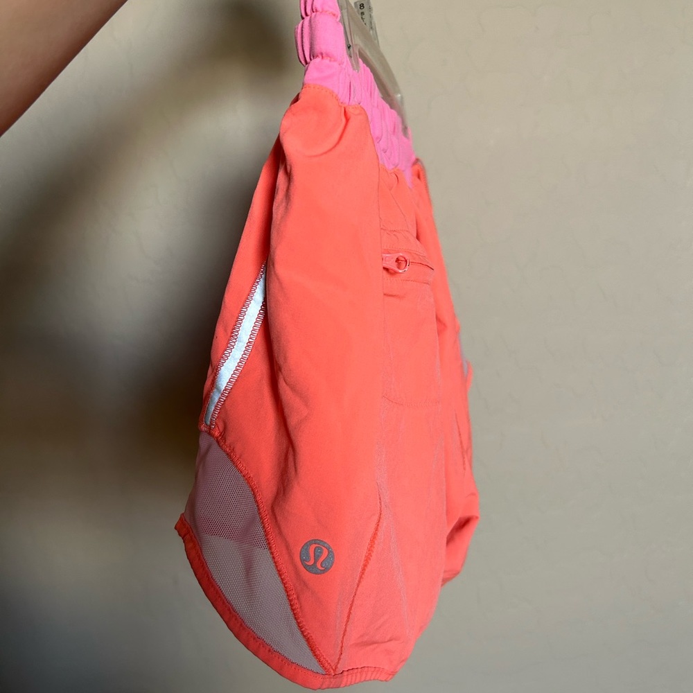 lululemon athletica neon pinkish orange hotty hot shorts